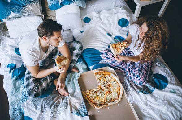 man, woman, pizza, bed