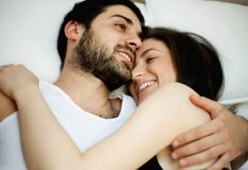 couple in bed, intimacy, potency capsules